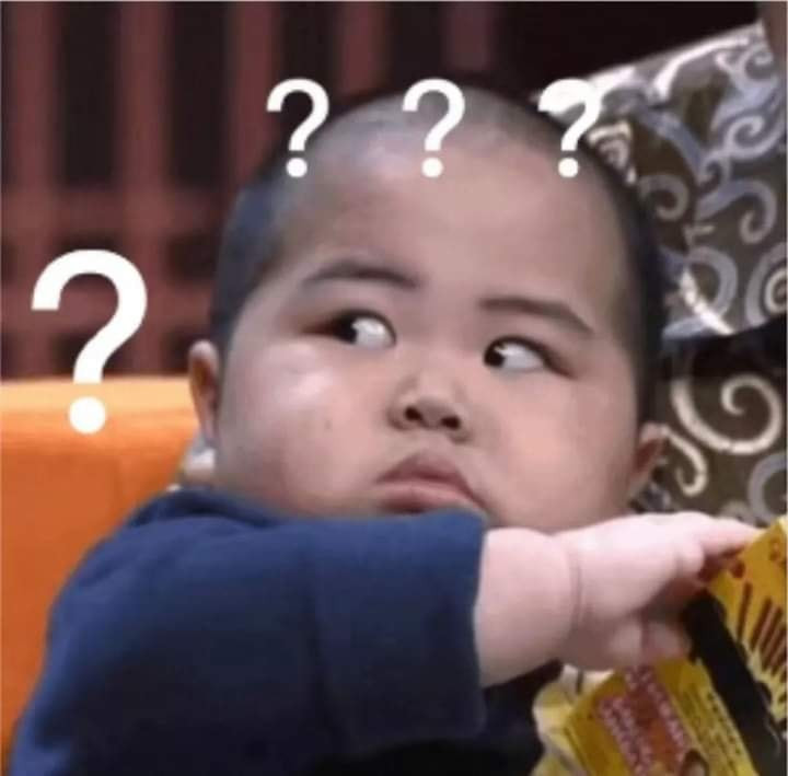 Amazed Asian kid with lots of question marks