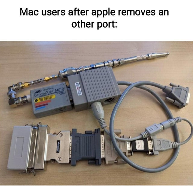 Mac users after Apple removes an other port - many port converters and adapters meme